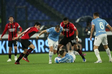 ROME, İtalya - 24.04.2022: S.RADU (LAZIO), MESSIAS (MIL), CALABRIA (MIL) İtalyan Serisi sırasında SS LAZIO 'ya karşı AC MILAN Roma Olimpiyat Stadyumu' nda oynanan futbol karşılaşmasında