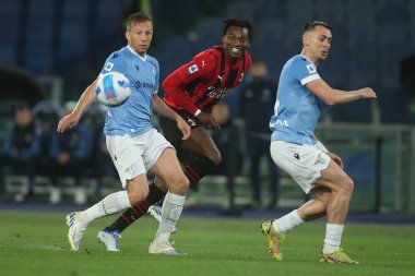 ROME, Italy - 24.04.2022:  LUCAS LEIVA (LAZIO), LEAO (MIL) in action during the Italian Serie A football match between SS LAZIO VS AC MILAN at Olympic stadium in Rome