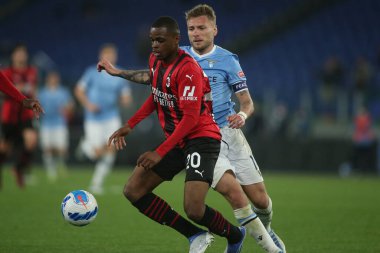 ROME, Italy - 24.04.2022:  KALULU (MIL), CIRO IMMOBILE (LAZIO) in action during the Italian Serie A football match between SS LAZIO VS AC MILAN at Olympic stadium in Rome
