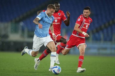 ROME, Italy - 07.05.2022: CIRO IMMOBILE (LAZIO), COLLEY (SAMP)  in action during the Italian Serie A football match between SS LAZIO VS SAMPDORIA GENOA  at Olympic stadium in Rome.