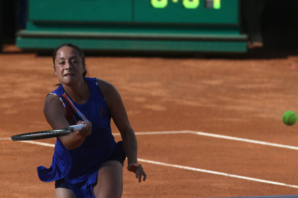 ROME, ITALY - MAY 09: Elisabetta Cocciaretto of Italy plays a forehand against Belinda Bencic of Switzerland during their single women round match in the Internazionali BNL D'Italia at Foro Italico on May 09, 2022 in Rome, Italy.