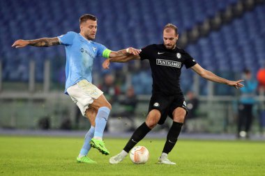 Rome, Italy 13.10.2022:  Immobile of Lazio and Stankovic of Sturm Graz in action during UEFA Europa League 2022/2023 Group f, day 4, S.S. Lazio vs Sturm Graz in Olympic Stadium in Rome on October 13, 2022 clipart