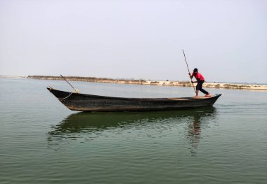 The scenetic view of the moving boat and the sailor