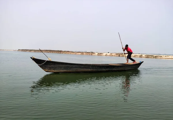 The scenetic view of the moving boat and the sailor