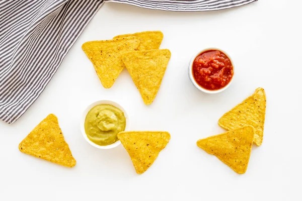 Mexican food nachos chips with salsa and guacamole sauces Stockbild
