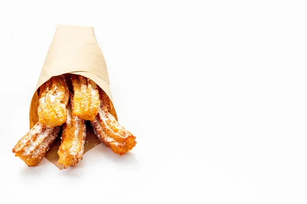 Churros postre de comida callejera en bolsa de papel — Foto de Stock
