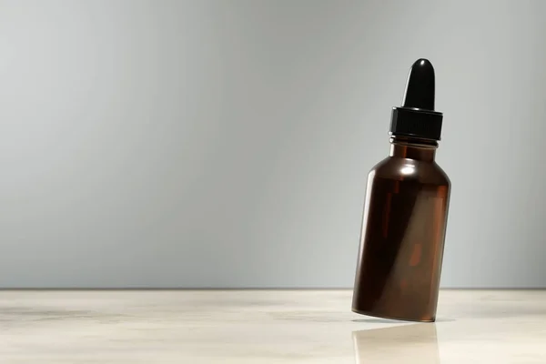 Blank cosmetic serum bottle. Dropper bottle product presentation