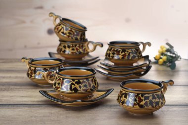 Set of tea cups on a wooden base