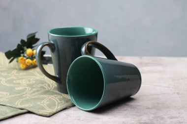 empty coffee mug in a creative composition