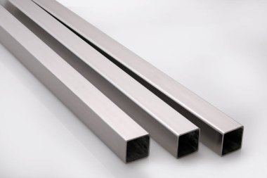 Stainless steel pipes on a white base.