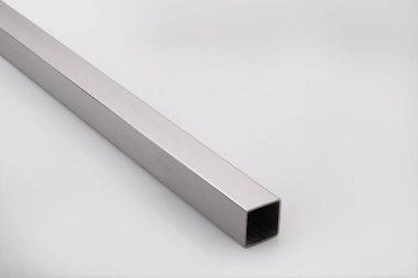 Stainless steel pipes on a white base.