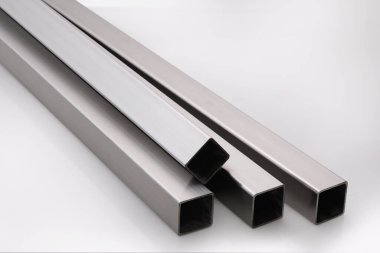 Stainless steel pipes on a white base.