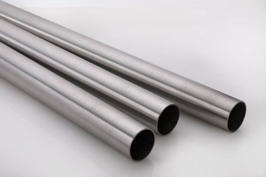 Stainless steel pipes on a white base.