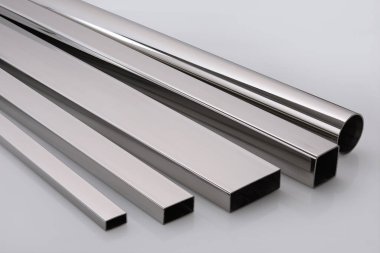 Stainless steel pipes on a white base.