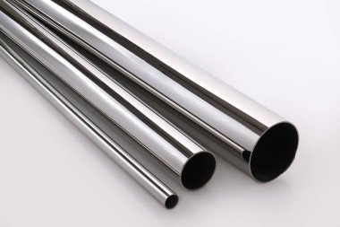 Stainless steel pipes on a white base.