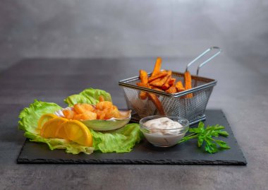 Fried Shrimps With Sweet Potatos In Gray background. High quality photo