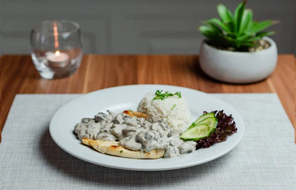 Fried Chicken Breast With Creamy Mushroom Sauce and Rice . High quality photo