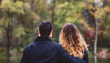 Cute couple Sitting In The Forest. High quality photo