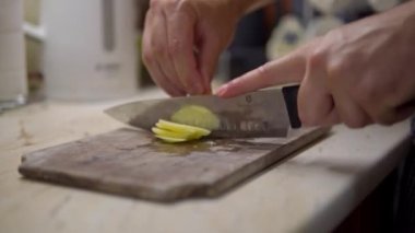 Chefs fast Hand cutting Potato, at home kitchen, chips making. High quality 4k footage