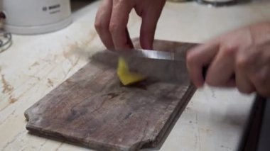 Chefs fast Hand cutting Potato, at home kitchen, chips making. High quality 4k footage