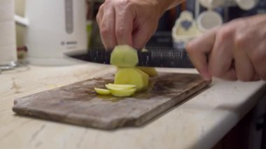 Chefs fast Hand cutting Potato, at home kitchen, chips making. High quality 4k footage