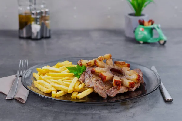 fried ribs with toasted bacon and french fries in the hotel restaurant. High quality photo