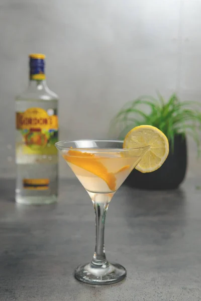 The Classic Summer Jin Tonic cocktail with Lemon and Orange A Ring Of Orange Peel in a Hotel Bar. High quality photo