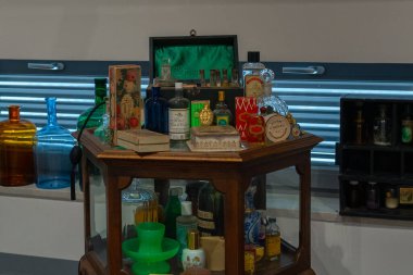 old beautiful perfume bottles on wooden cupboard. High quality photo