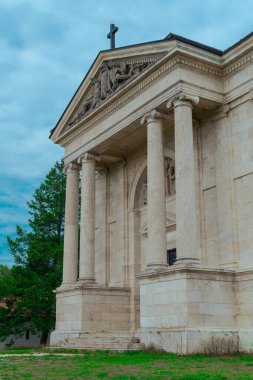 ancient church exterior In background with clouds and Trees, Hungary. High quality photo