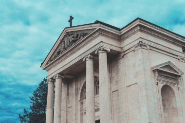 ancient church exterior In background with clouds and Trees, close-up, Hungary. High quality photo