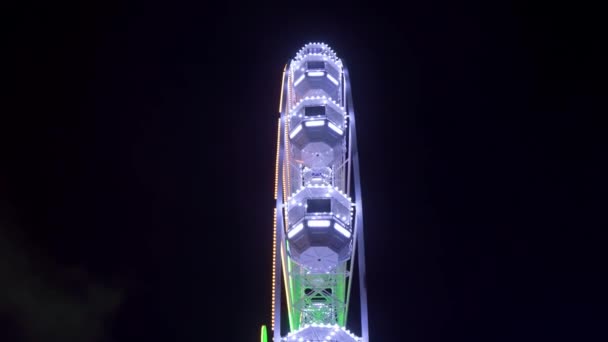 Illuminated Ferris Wheel Rotating Night Side View Black Isolated Background — Stock Video