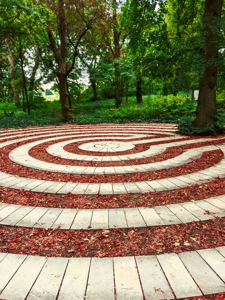 round shape stone architecture within forest, arboretum. High quality photo