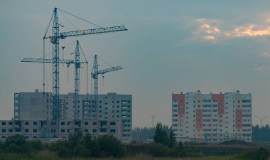 construction of a residential building with a tower crane