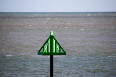 A navigation marker on the sea shore.