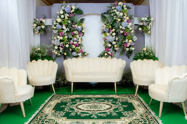 Wedding decorations. Wedding backdrop with flowers and Indonesian wedding decorations.