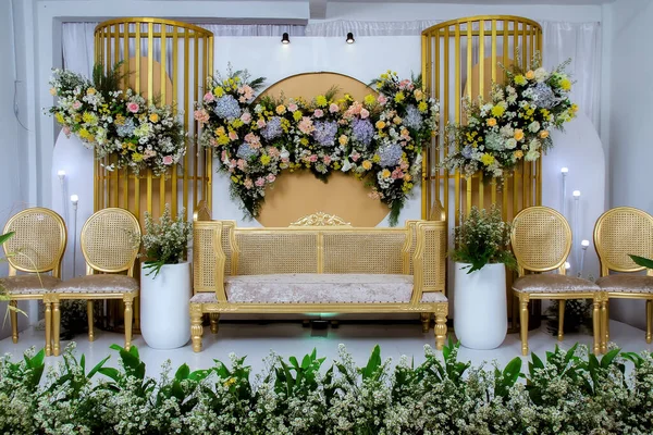 Wedding decorations. Wedding backdrop with flowers and Indonesian wedding decorations.