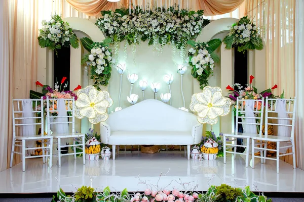 Wedding decorations. Wedding backdrop with flowers and Indonesian wedding decorations.