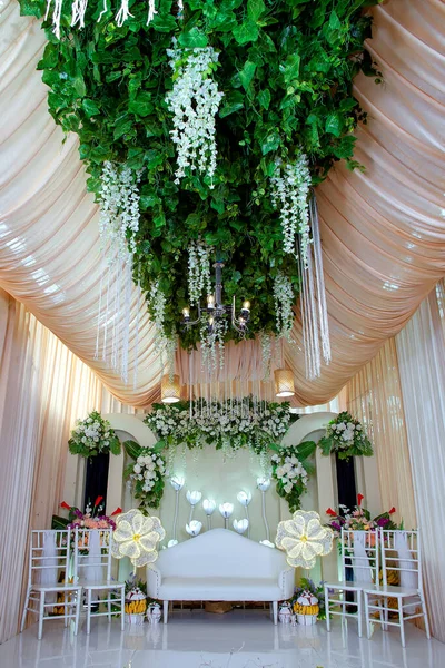 Wedding decorations. Wedding backdrop with flowers and Indonesian wedding decorations.