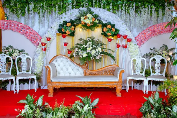 Wedding decorations. Wedding backdrop with flowers and Indonesian wedding decorations.