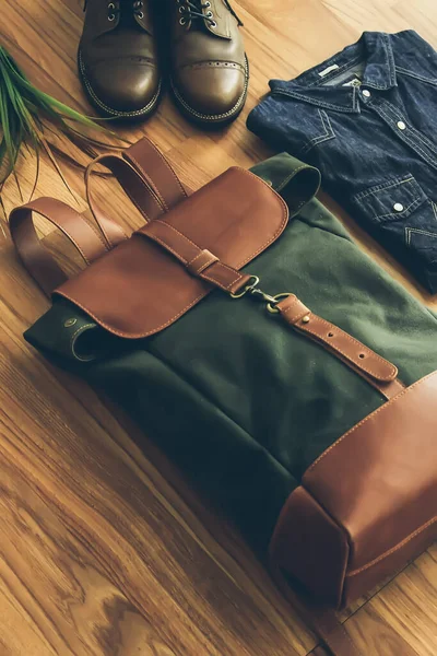 A handbag or sling bag made of brown leather in a minimalist style or a minimalist and luxurious retro color.