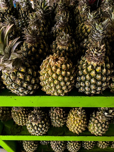 green pineapple at the supermarket