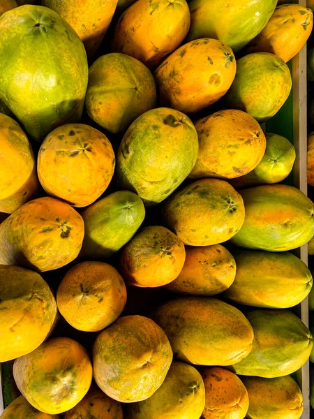 Papayas line the market - papaya fruit at the supermarket