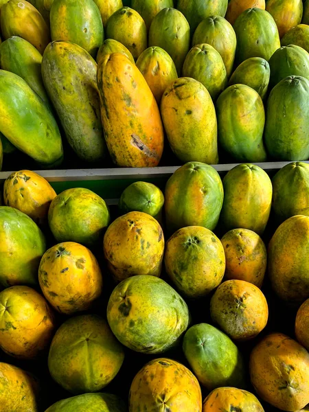 Papayas line the market - papaya fruit at the supermarket