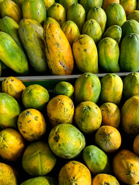 Papayas line the market - papaya fruit at the supermarket