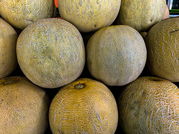 Whole melon, honeydew melon or honeydew melon and food texture close up. Melon at the supermarket.