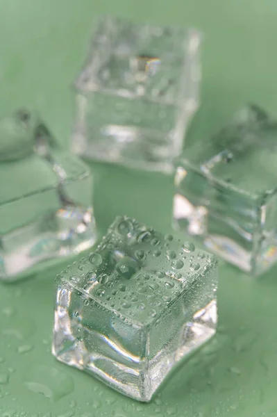 Multiple Frozen Ice Cubes Green Background — 图库照片