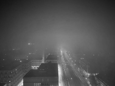 Munich by night and fog from above 