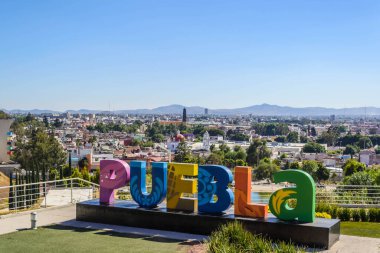 Colorful Sign for Puebla overlooking the city from Los Fuertes.