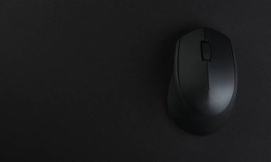 Wireless computer mouse, on a black background