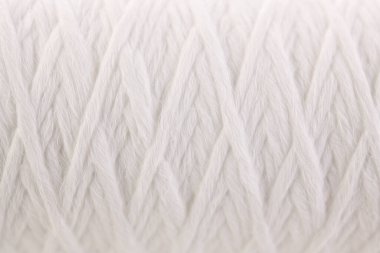 Roll of white rope water filter close up isolated on white background